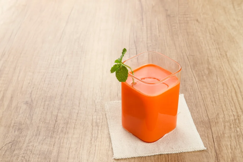 A refreshing carrot-orange smoothie, an example of what fruits pair with carrots