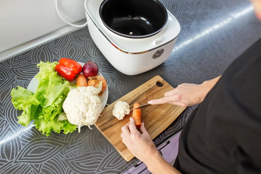 Preparation of vegetables for a slow cooker meal